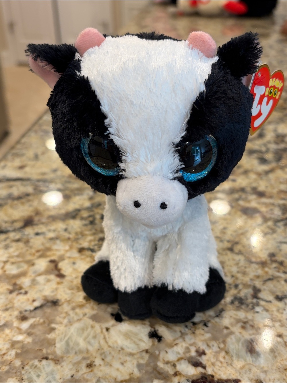 Ty “Butter”, Black and White Cow Plush with Sparkly Blue Eyes